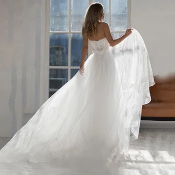 2023 Сватбена рокля без ръкави с отворен гръб и влак трапецовидна форма, Романтична сватбена рокля с отворен гръб и отворени рамене